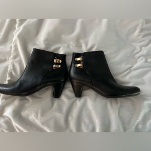 Sam Edelman marking black ankle boots.
